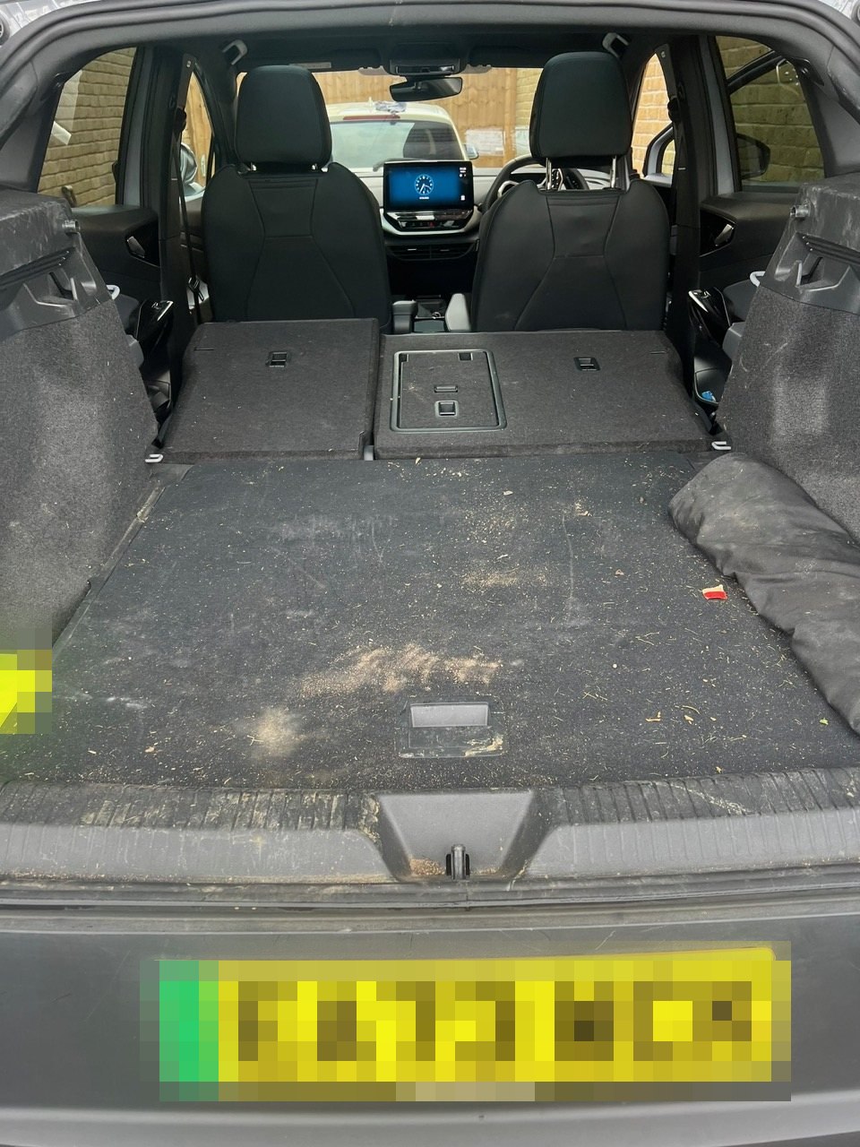 Volkswagen ID.5 boot before cleaning, with a heavily soiled load space