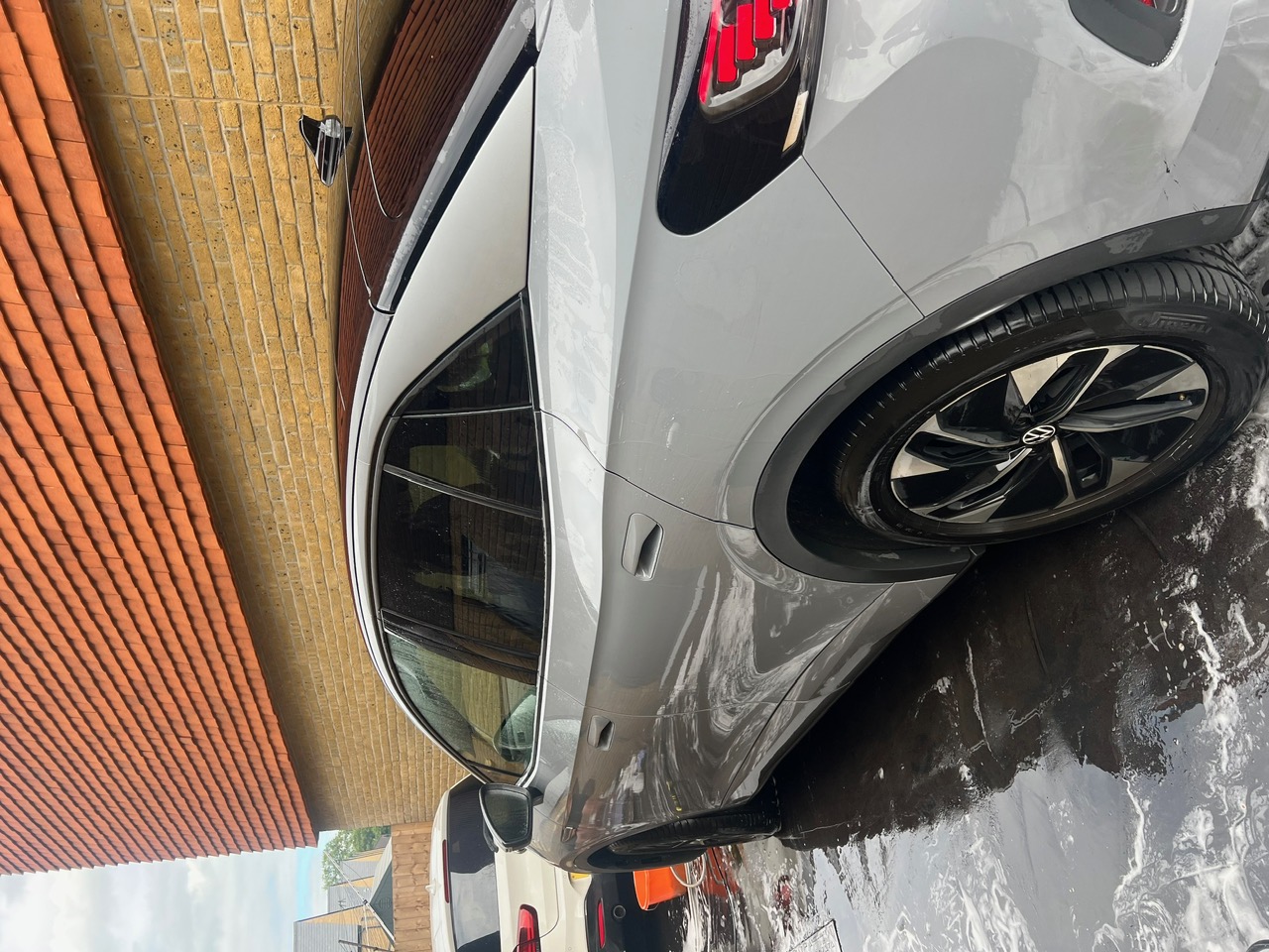 Clean Volkswagen ID.5 side and alloy after a maintenance wash