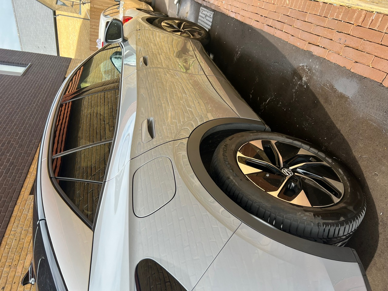 Volkswagen ID.5 being safely hand washed on a driveway