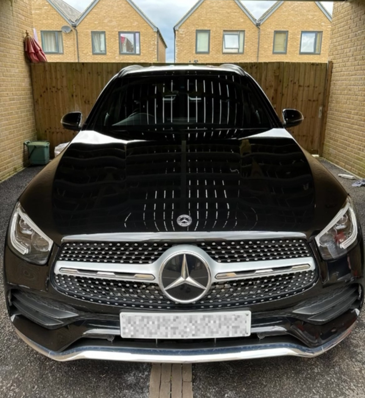 Glossy black Mercedes front end after a full valet